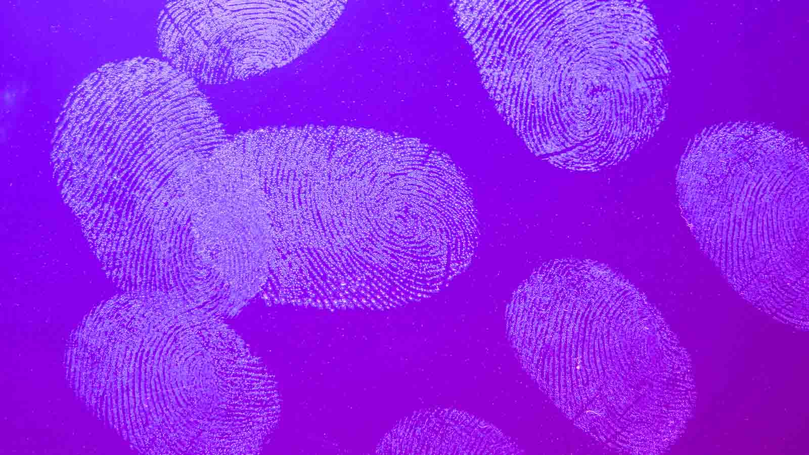Fingerprints on glass with red and blue background