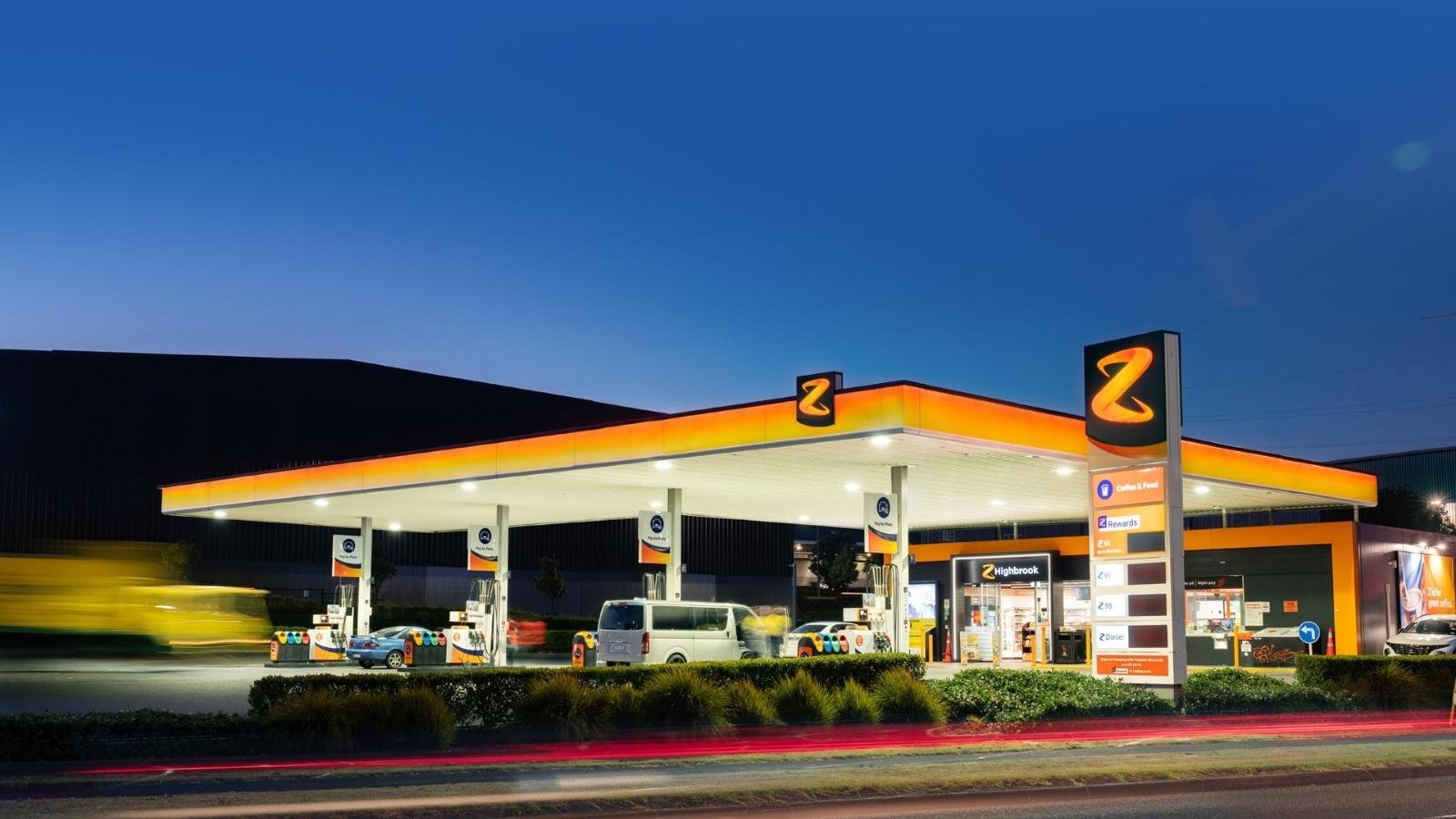 Z Energy service station lit up at dusk with vehicles refueling
