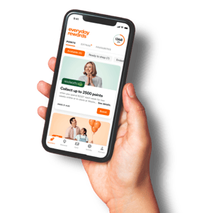 Hand holding a smartphone displaying the Everyday Rewards app interface with a points balance of 1368 and a Woolworths points collection offer.