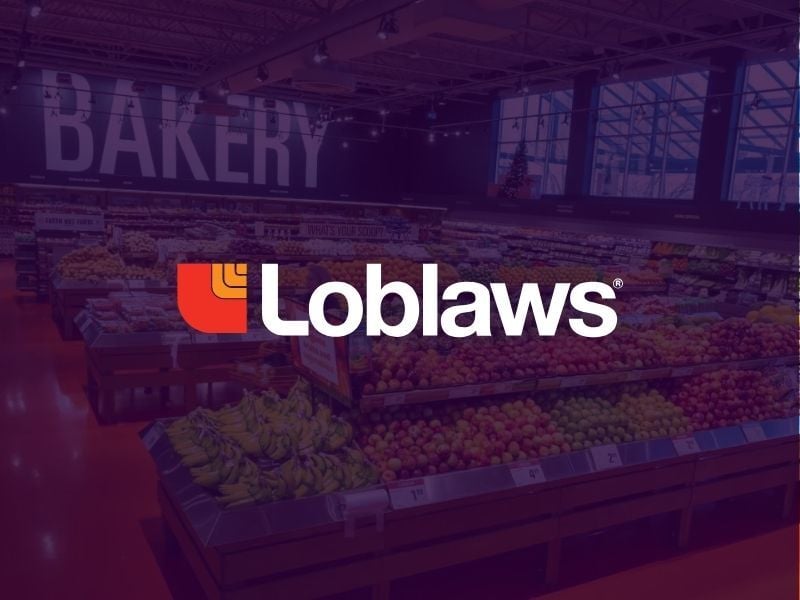 Loblaws grocery store produce section with brand logo overlayed in white text