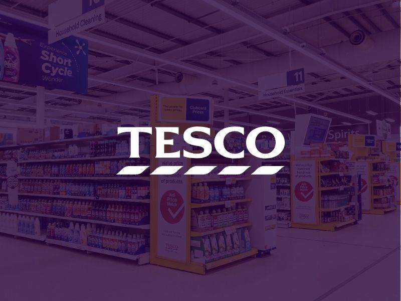 Tesco supermarket aisle with Clubcard signage and Tesco logo overlay